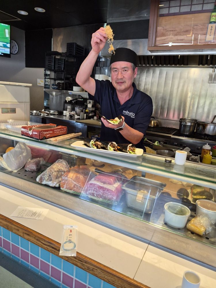 A Minato Sushi regular enjoying a meal at the restaurant