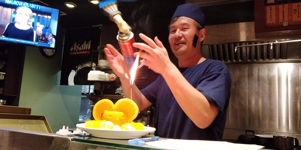 A Minato Sushi regular enjoying a meal at the restaurant