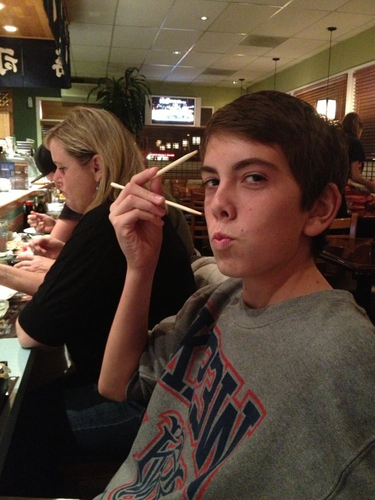 A Minato Sushi regular enjoying a meal at the restaurant