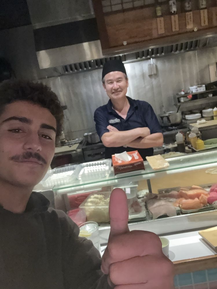 A Minato Sushi regular enjoying a meal at the restaurant