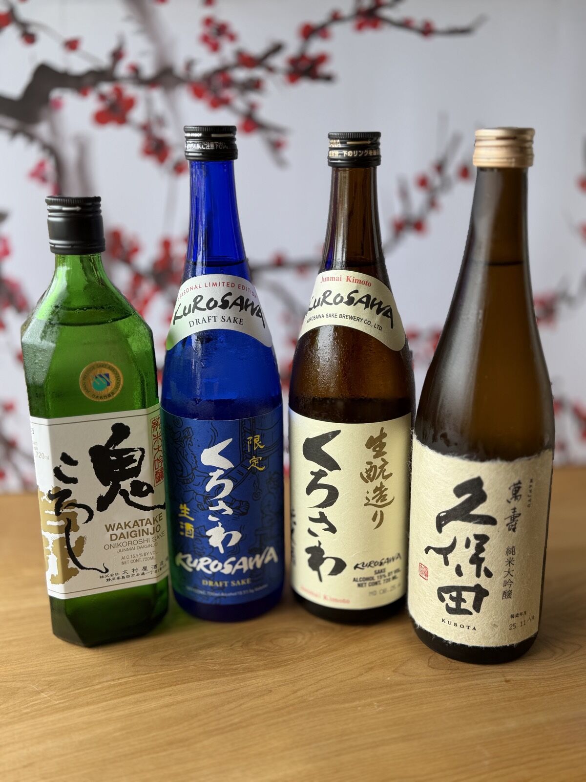 The four featured sakes at Minato Sushi lined up together
